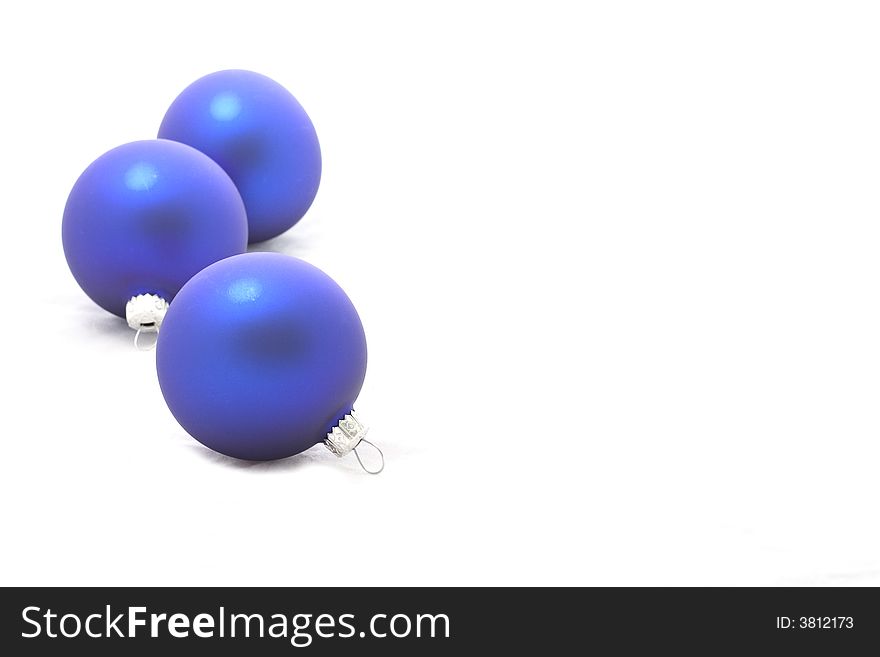 A three blue christmas balls isolated on white background.