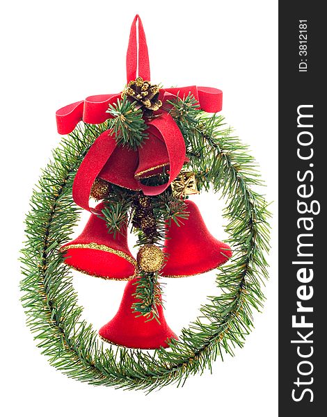 A Christmas wreath with red bells and red bow isolated on white background.