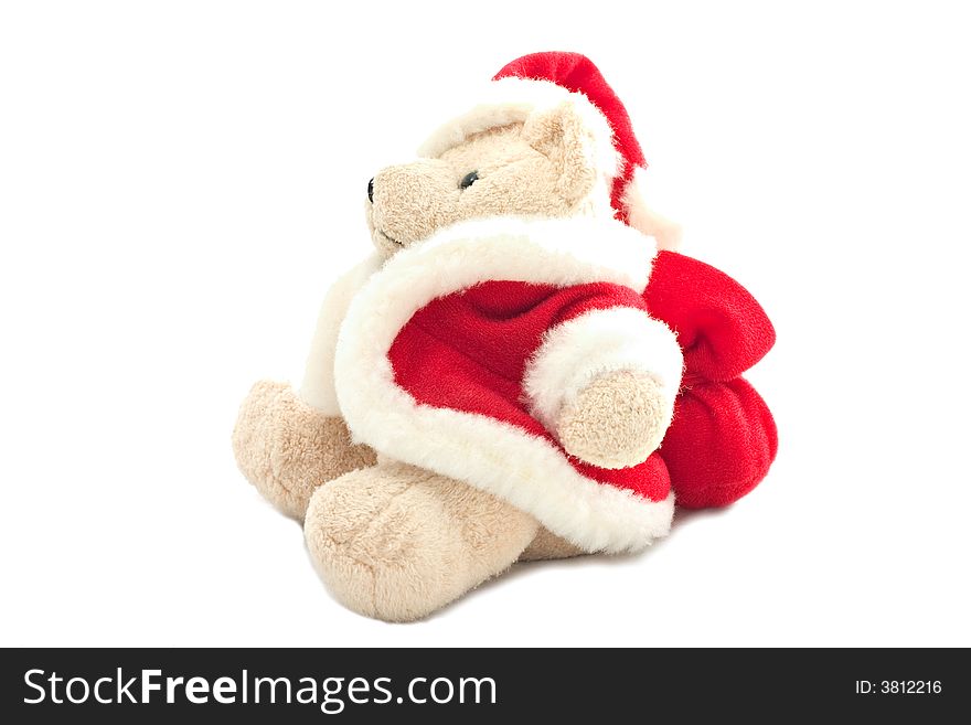 A teddy bear in santa claus dress isolated on white background.