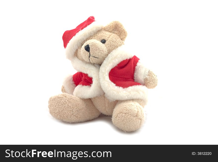 A teddy bear in santa claus dress isolated on white background.