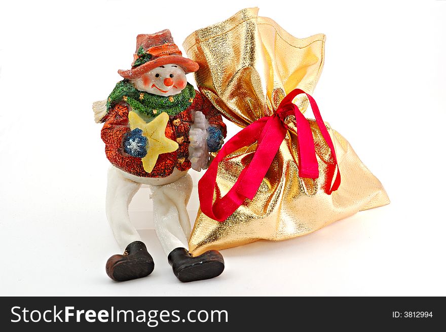 Porcelain figure and gift on white background