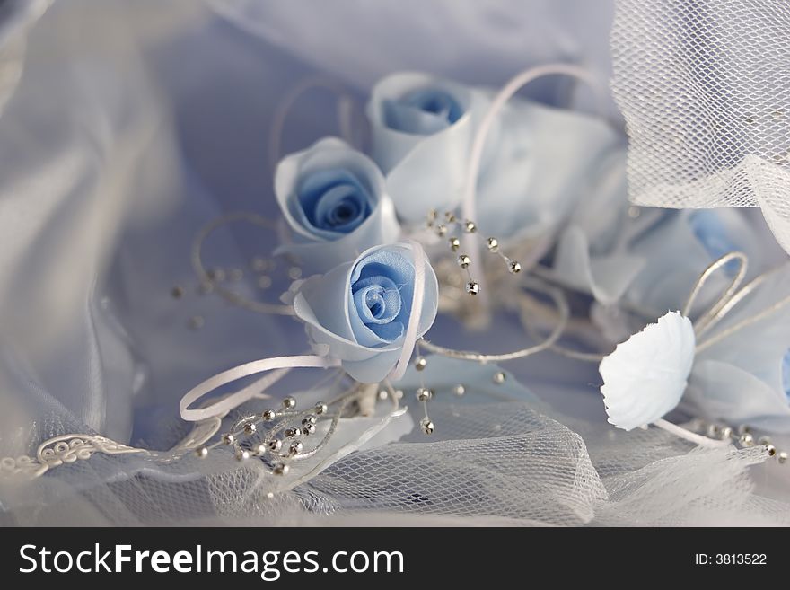 Blue roses and laces on a wedding gown. Blue roses and laces on a wedding gown