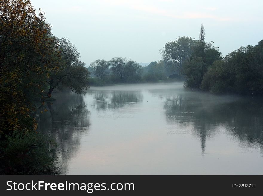 Evening autumn mist falling over the river Krka in Slovenia. Evening autumn mist falling over the river Krka in Slovenia.