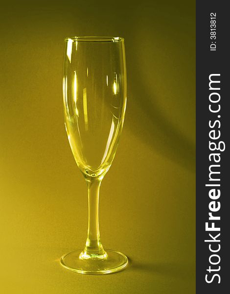Empty champagne glass toned in yellow. Empty champagne glass toned in yellow