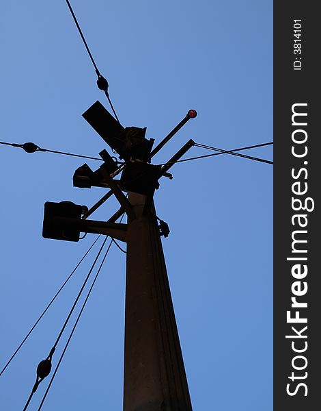 Silhouette of vessel's mast against blue cloudless sky. Silhouette of vessel's mast against blue cloudless sky