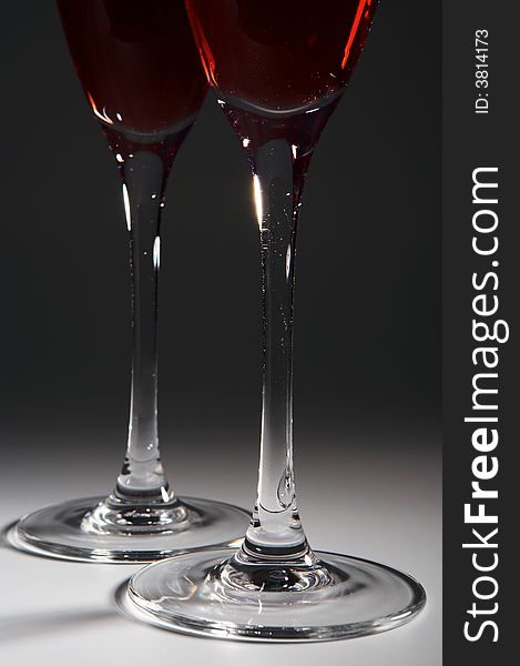 Two beautiful brilliant glasses with red wine