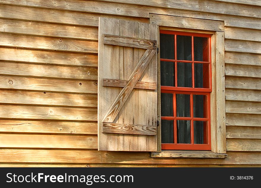 Red Window In A Weathered Wood Building