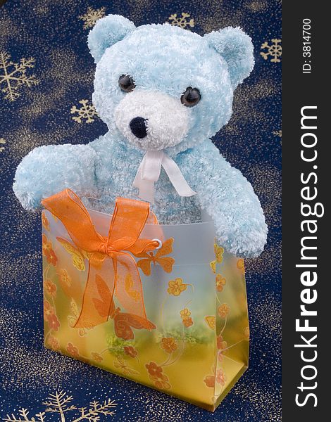 Toy bear on Christmas background