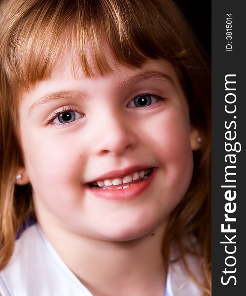 Face-only portrait of a smiling young elementary girl. Face-only portrait of a smiling young elementary girl.
