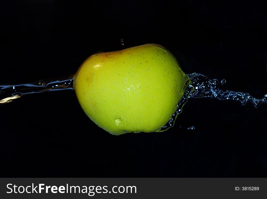 Green fresh apple motion in cold  water