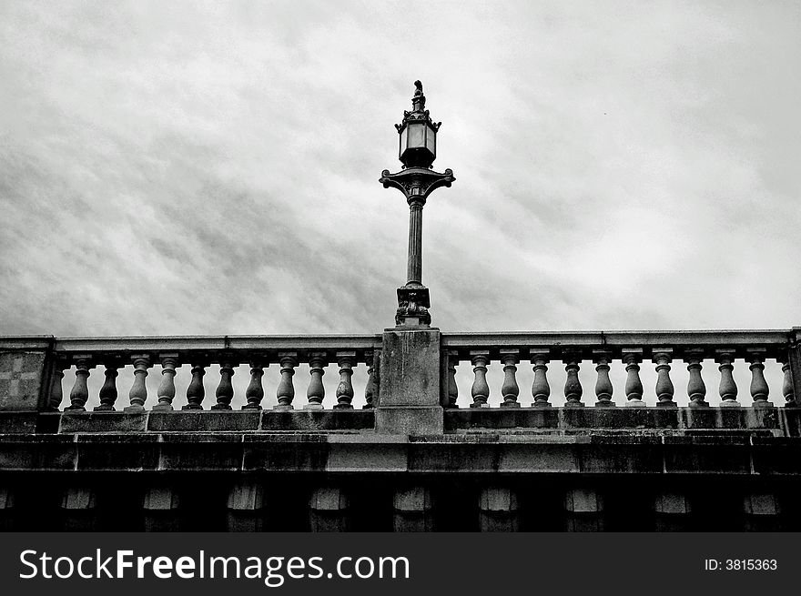 An upward shot of an old brick bridge done in black and white. An upward shot of an old brick bridge done in black and white.