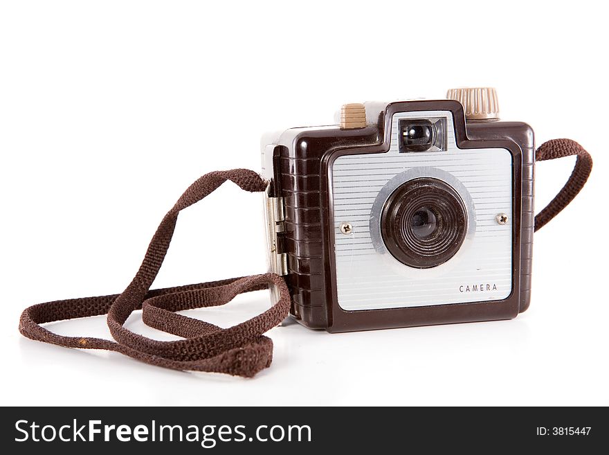 Retro point-and-shoot camera isolated on white.