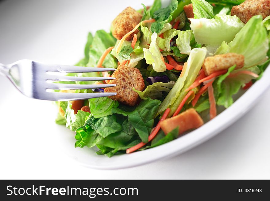 Close up of generic salad isolated on white background. Close up of generic salad isolated on white background.