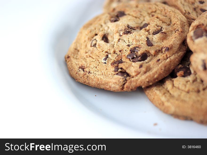 Close up picture of cookies on a white plate on a white background. Close up picture of cookies on a white plate on a white background.