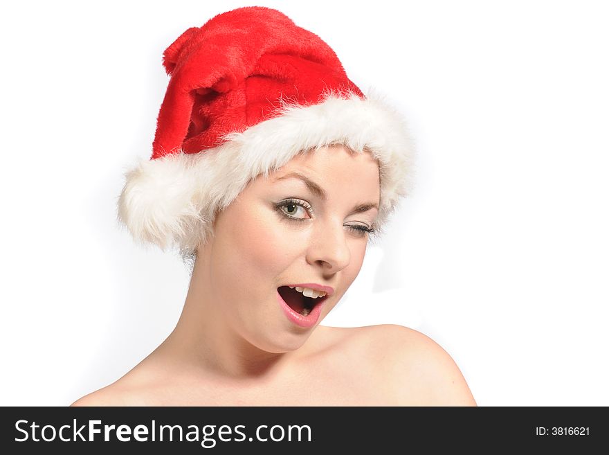 A young female model wearing a santa hat and a smile. A young female model wearing a santa hat and a smile