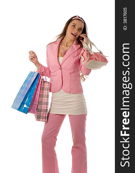 Attractive young woman chatting on the phone while shopping. Attractive young woman chatting on the phone while shopping