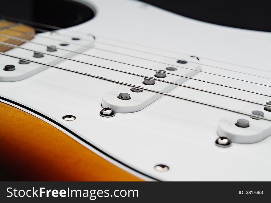 Close up of electric guitar and strings from the pick's point of view. Close up of electric guitar and strings from the pick's point of view