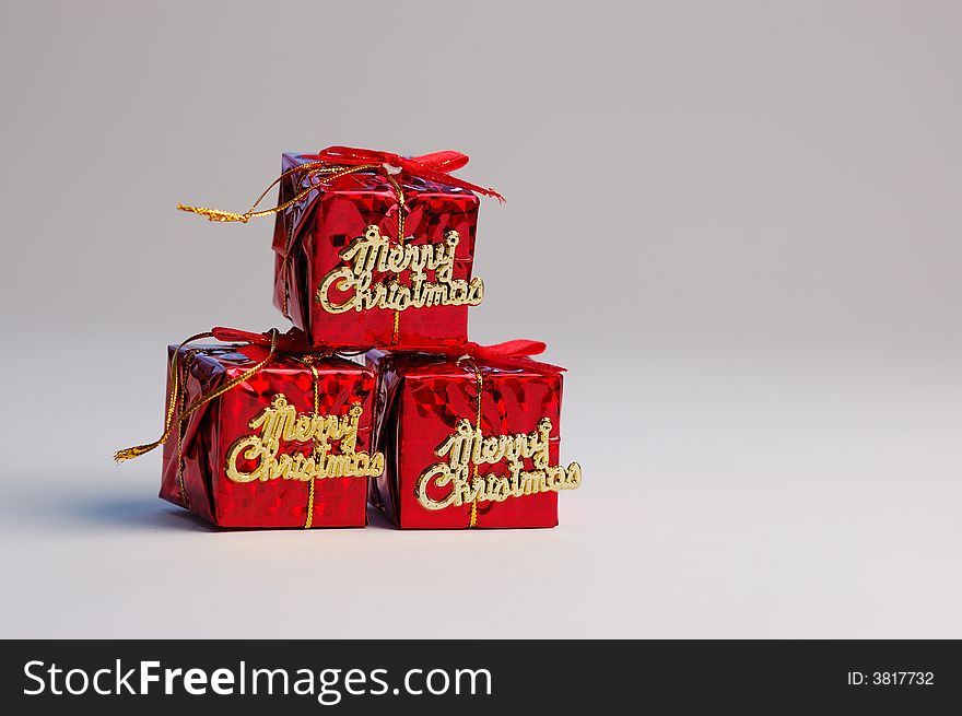 Red gifts on white background. Christmas decoration.