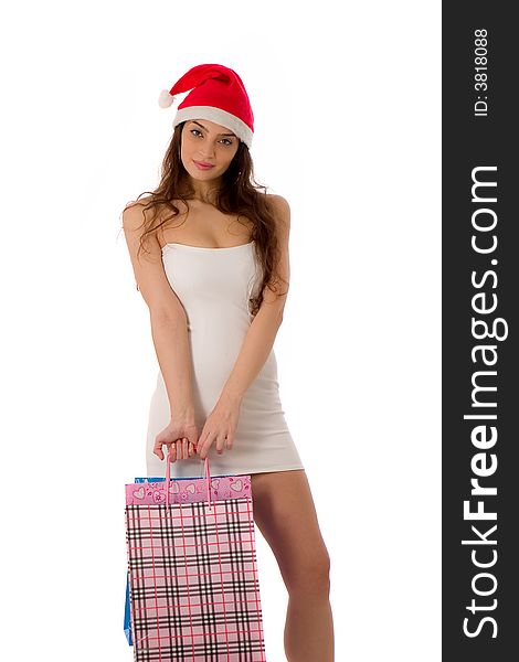 Beautiful girl with santa hat in holiday shopping