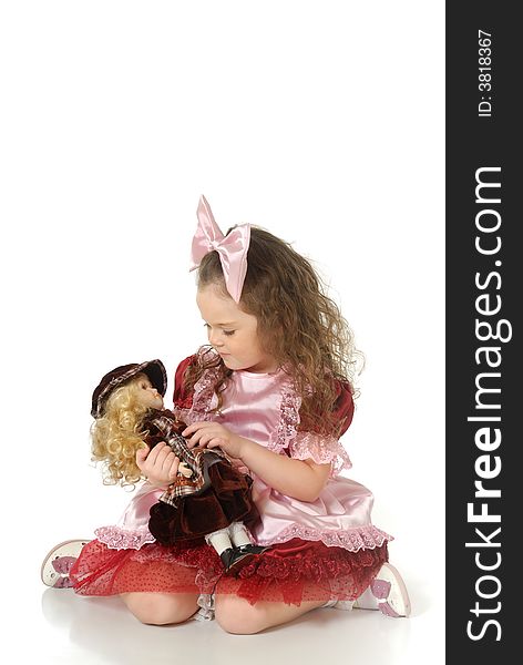 The little girl in a doll festive attire for masquerade