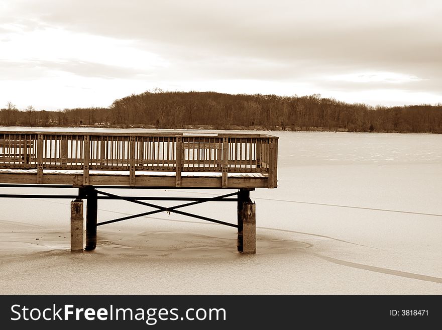 Wooden Dock On A Frozen Lake