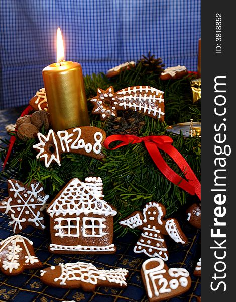 Christmas motive with advent candle
and gingerbread. Christmas motive with advent candle
and gingerbread