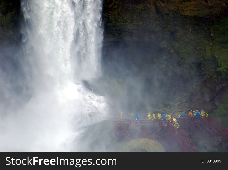 Tourists explore the base of the Bridal Veil falls, the smallest of Niagara's three great falls. Tourists explore the base of the Bridal Veil falls, the smallest of Niagara's three great falls.