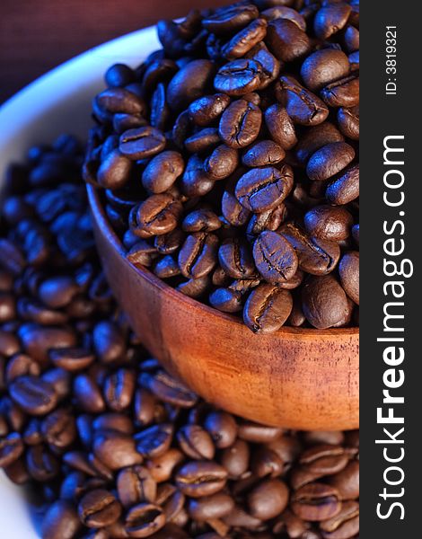 Close up of Backlit Coffee beans in a bowl. Close up of Backlit Coffee beans in a bowl