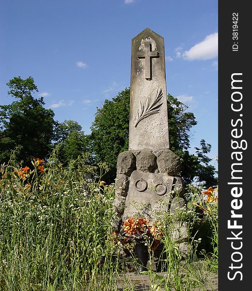 Old statue in cemetery. background