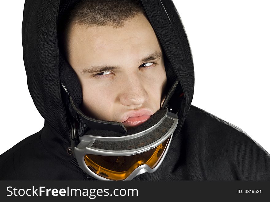 A teenager boy dressed in a snowboarding suit with googles acting fierce and determined. A teenager boy dressed in a snowboarding suit with googles acting fierce and determined.