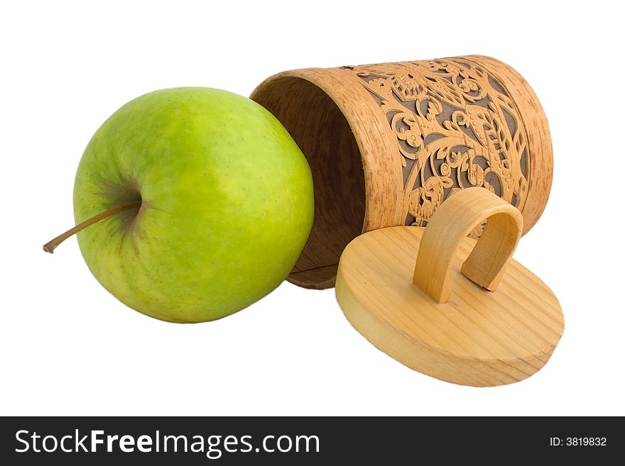 Accurate wooden gift box with a green apple isolated on white. Accurate wooden gift box with a green apple isolated on white