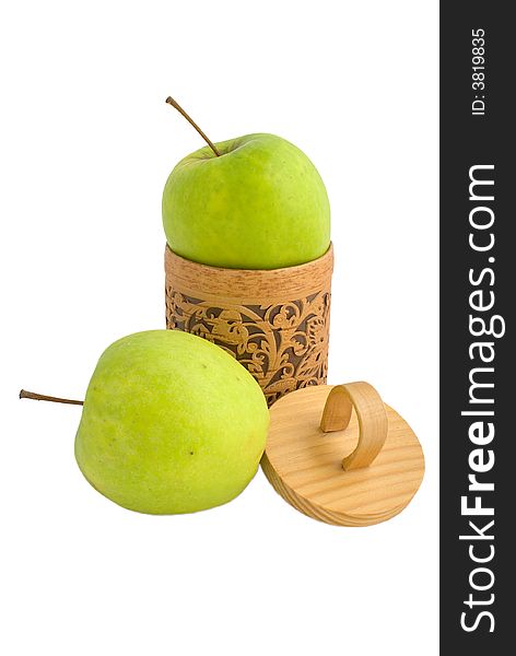 Accurate wooden gift box with two green apples isolated on white. Accurate wooden gift box with two green apples isolated on white