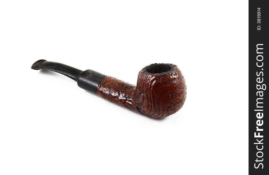 Brown old tobacco pipe on white background