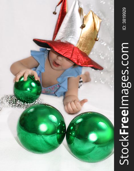 Beautiful little girl with christmas decoration green