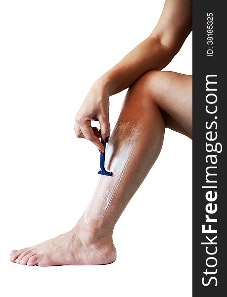 Woman shaves leg isolated on white background