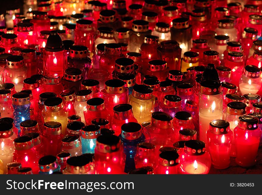 Lighted candles glowing in the dark