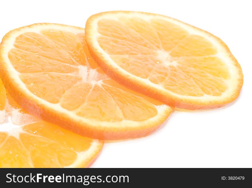 Three part of oranges over the white