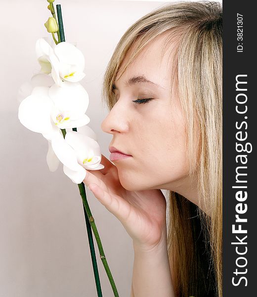 Close up of beautiful woman with white orchid. Close up of beautiful woman with white orchid