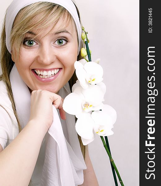 Close up of beautiful woman with white orchid. Close up of beautiful woman with white orchid