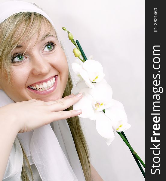 Close up of beautiful woman with white orchid. Close up of beautiful woman with white orchid