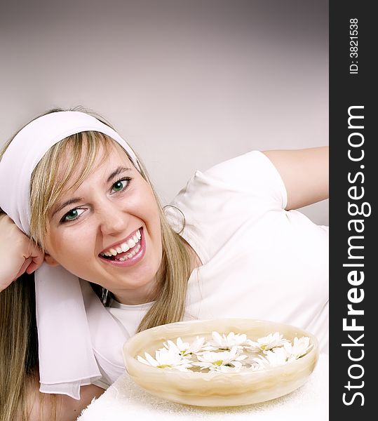 Close up of beautiful woman with bowl of daisies. Close up of beautiful woman with bowl of daisies