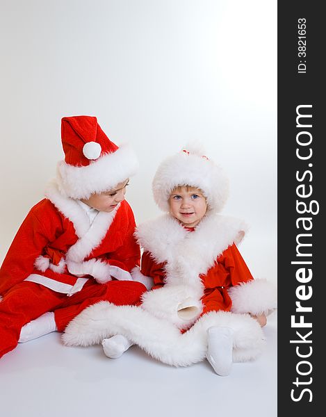 Two baby Santa portrait isolated. Two baby Santa portrait isolated