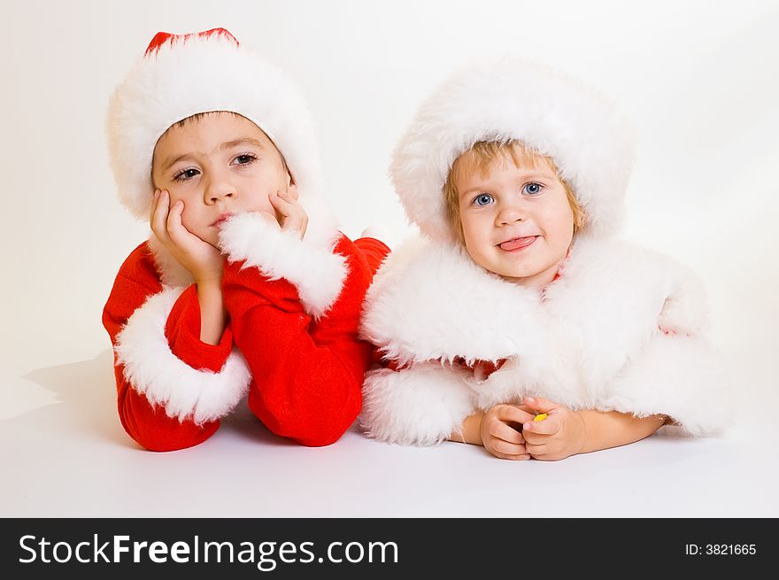 Two baby Santa portrait isolated. Two baby Santa portrait isolated