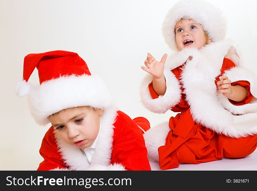 Two baby Santa portrait isolated. Two baby Santa portrait isolated