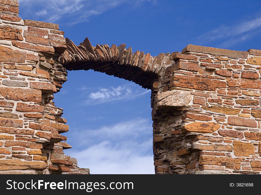 Detail of window arch weathered to a line of stones. Detail of window arch weathered to a line of stones