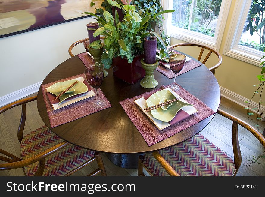 Table with modern plates, chop sticks and decor. Table with modern plates, chop sticks and decor.
