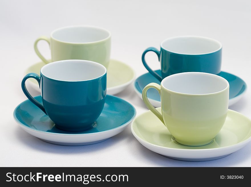 Blue and green coffee cups with matching saucer