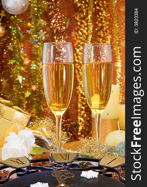 Christmas decoration of two glasses of champagne and the clock. Christmas decoration of two glasses of champagne and the clock.