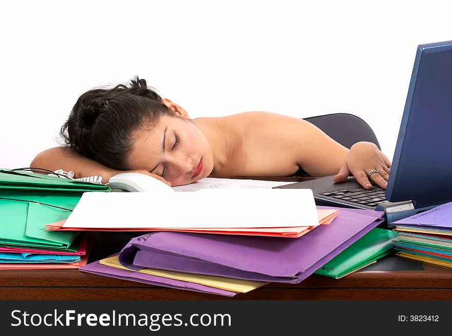 A businesswoman sleeping on her office desk