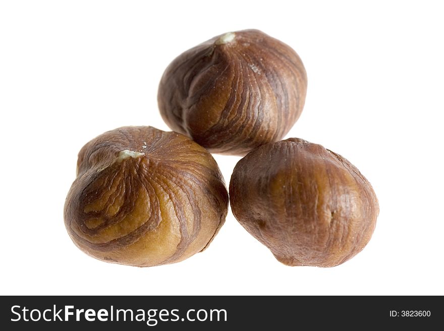 Close-up of hazel nuts on white